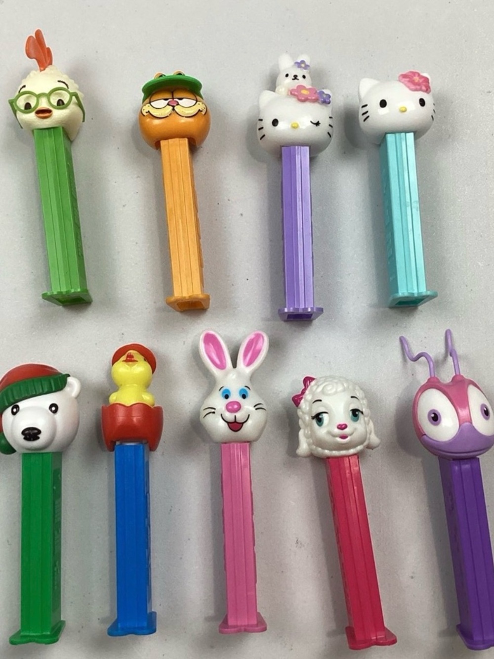 9 Vintage PEZ Dispensers with feet